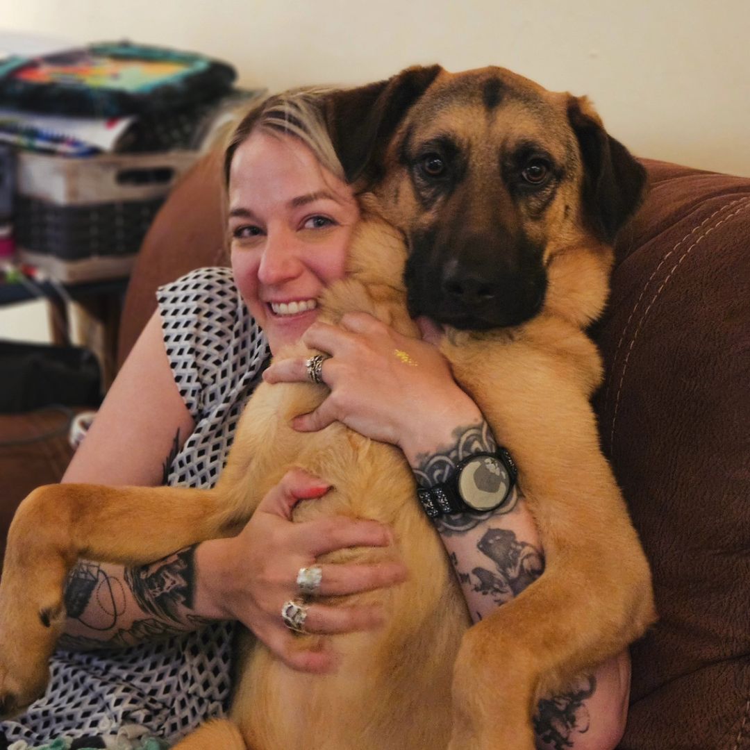 woman hugging a dog